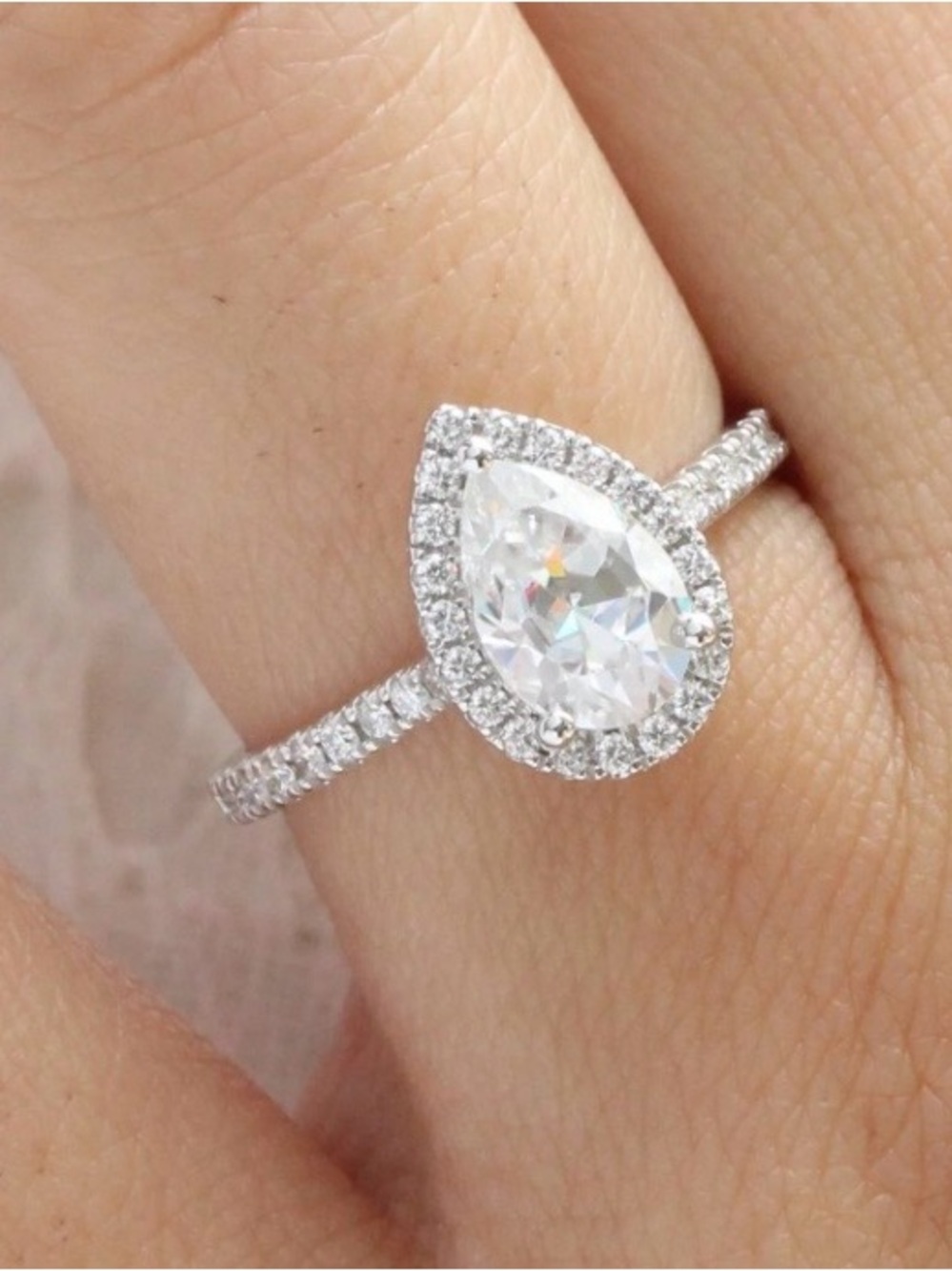 1 Carat Pear-Shaped Moissanite Halo Ring in 925 Silver with Pavé Band